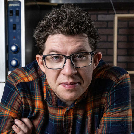Justin  Warner smiling right at you